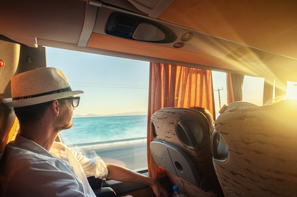 A man traveling with a bus